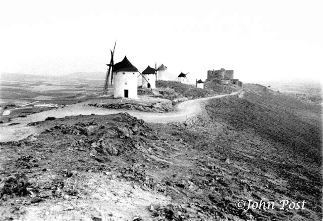 hilltop with windmills and castle
