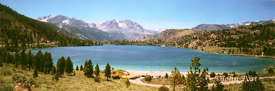 View accross June Lake towards Sierra mountains, clear blue sky