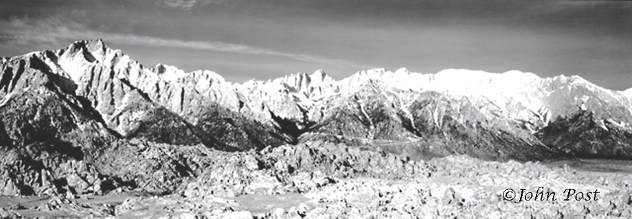 View accross snowfield towards Sierra mountains, clear blue sky