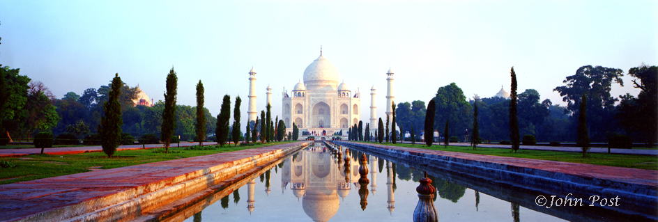 India, sunrise, Taj Mahal and reflection in long pool of water