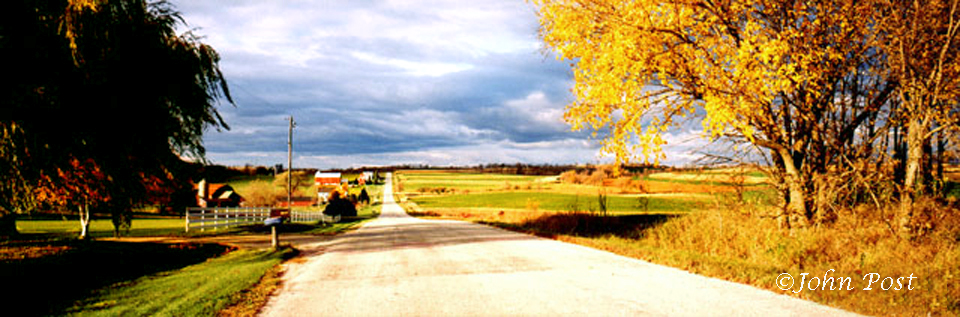 Dirt country road, farms, fields