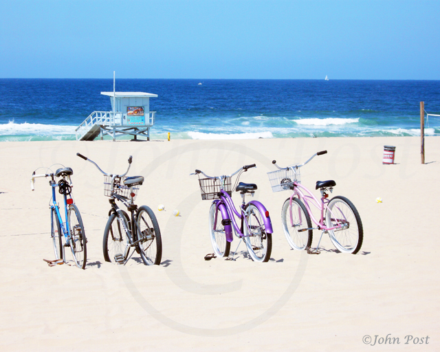 Four Bicycles on Beach with Lifeguard tower Manhattan Beach California