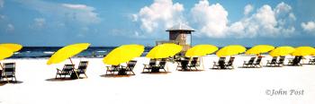 Beach Chairs Yellow Umbrellas and Lifeguard Tower
