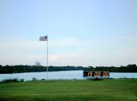 Pre Dawn at KSC Press Site Launch Pad 39A Countdown Clock and Flag